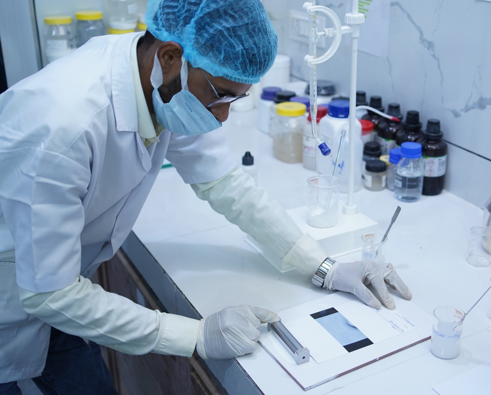 Laboratory technician doing drawdown testing